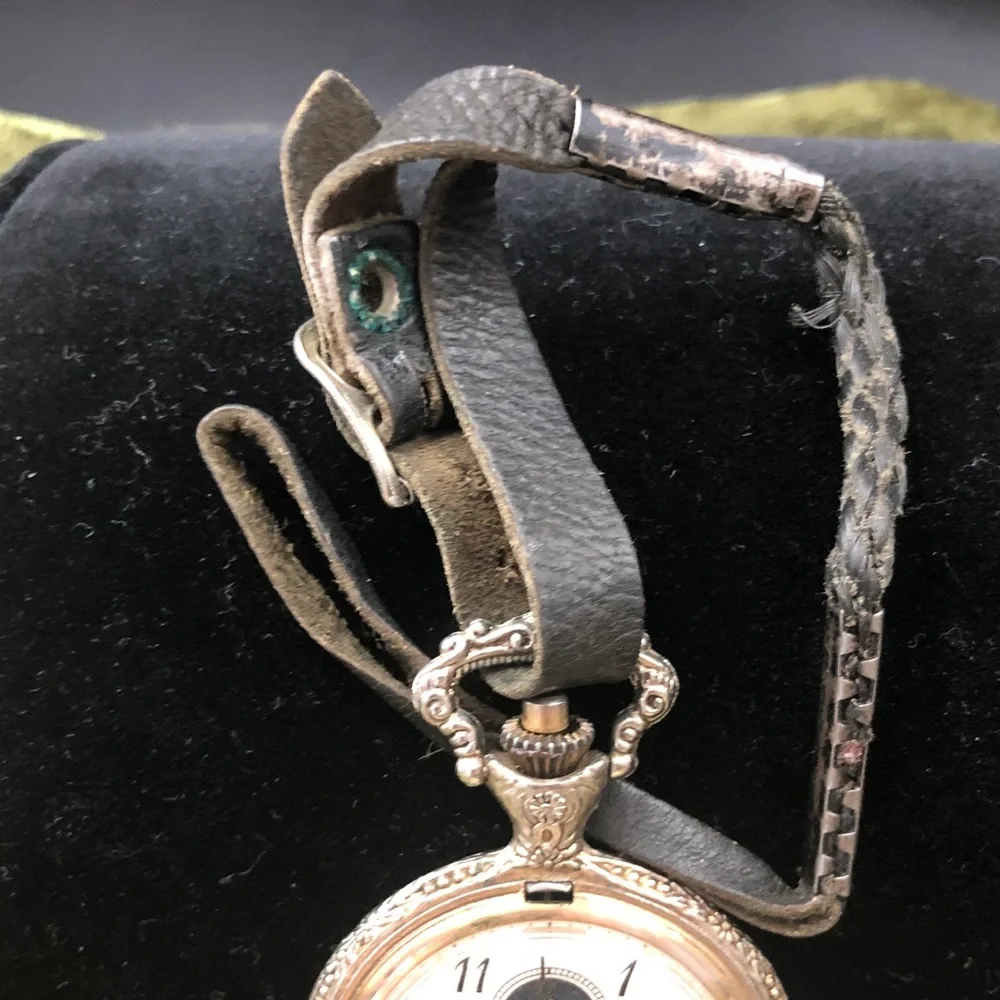 Silver-Tone Pocket Watch with Black Leather Strap man fishing
